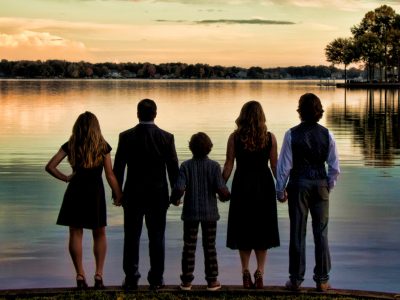 Family in front of Lake Norman at sunset